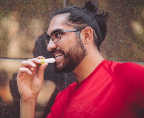 Man putting lip balm on
