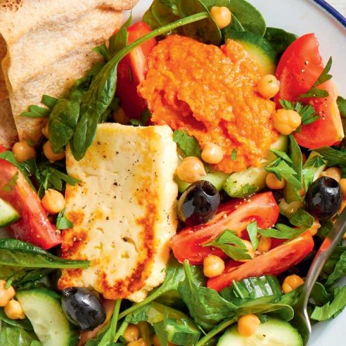 Greek mezze bowl with chickpeas and haloumi