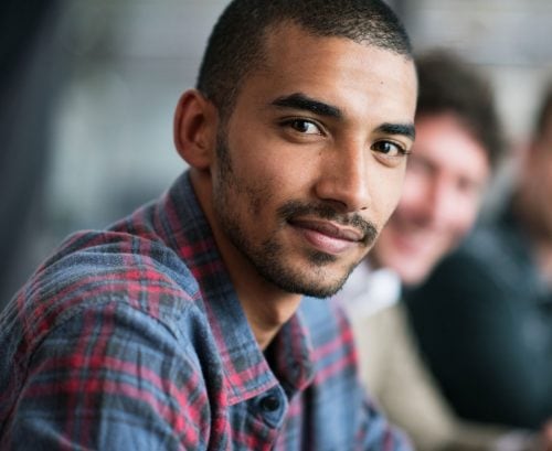 Young man looking directly into camera