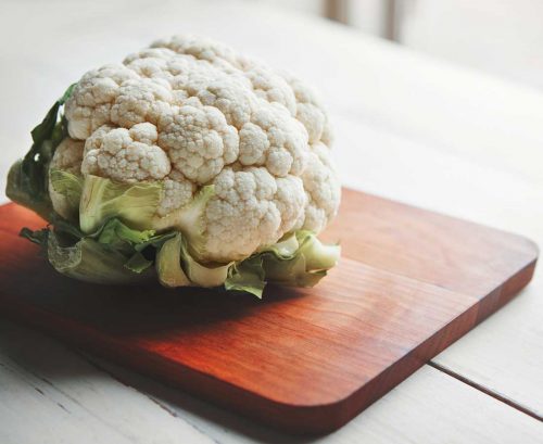 Head of cauliflower on a board
