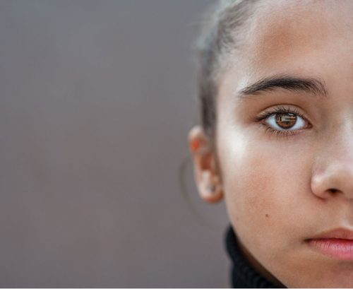 Headshot of girl focussing on the eye