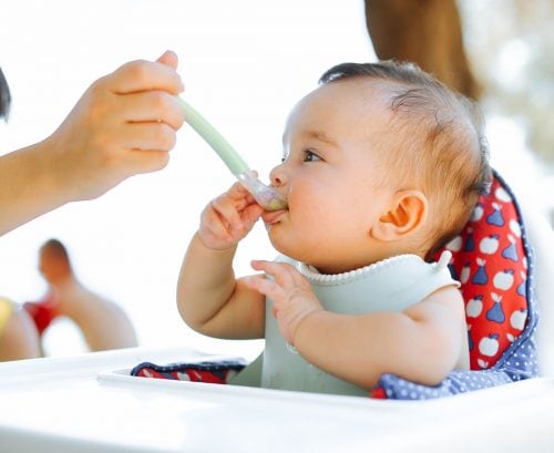 Baby being fed with a spoon