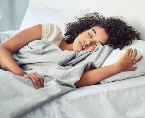 Woman asleep in bed