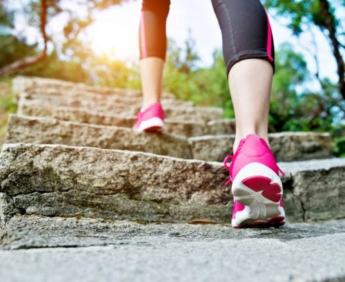 Woman walking up steps