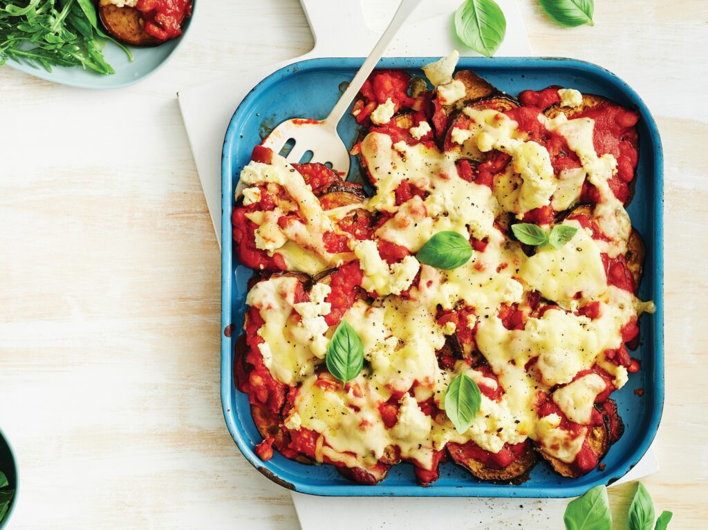 Eggplant parmigiana with basil leaf salad Eggplant parmigiana with basil leaf salad