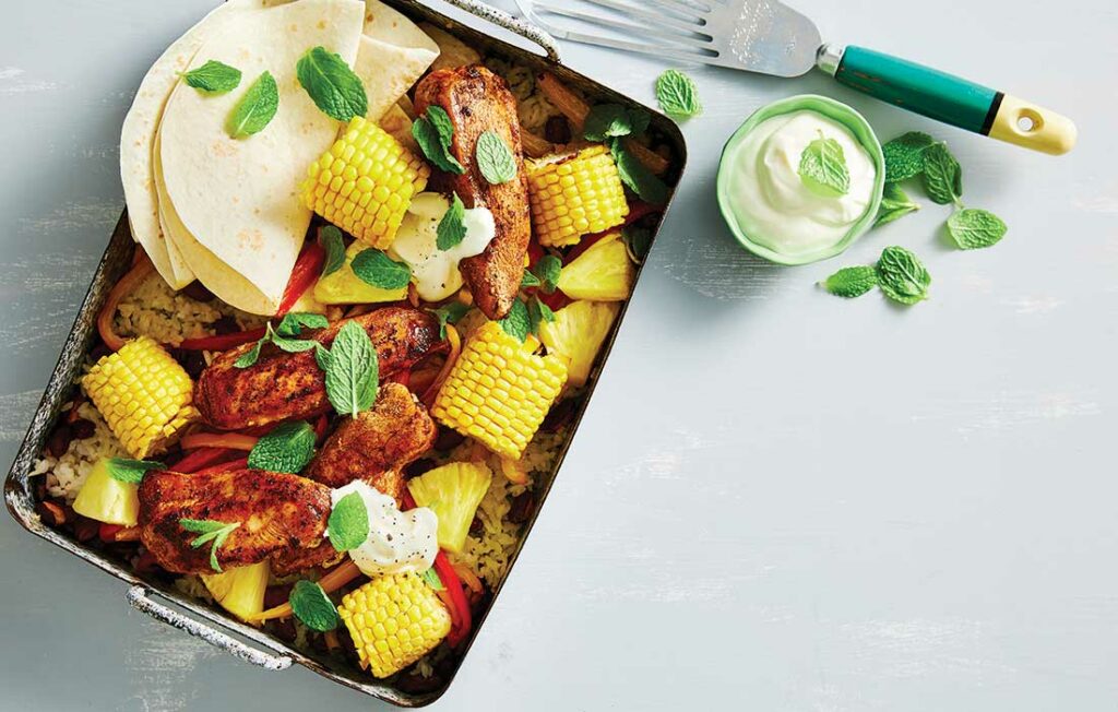 Sticky jerk chicken, rice and bean traybake