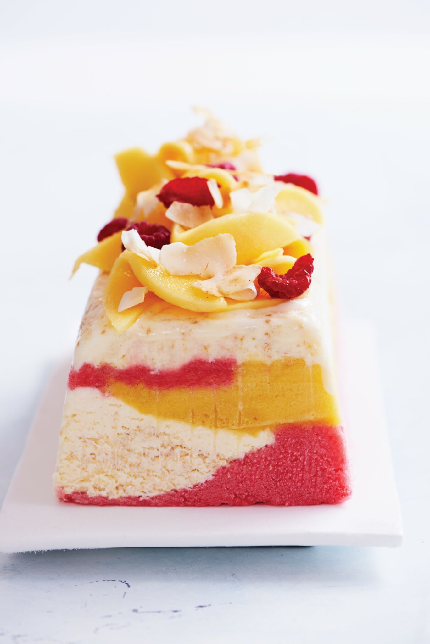 Coconut, mango and raspberry log