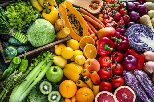 Healthy fresh rainbow colored fruits and vegetables background