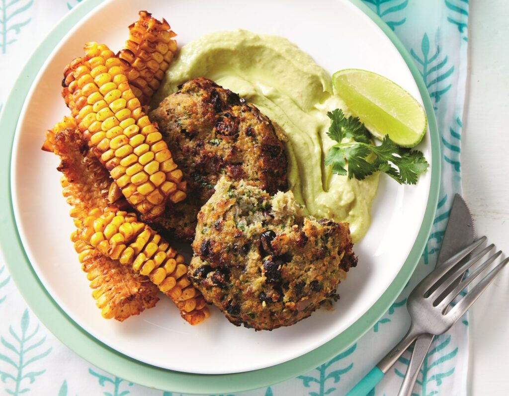 Air-fryer fish cakes with smoky corn ribs and avocado sauce Air-fryer fish cakes with smoky corn ribs and avocado sauce - web