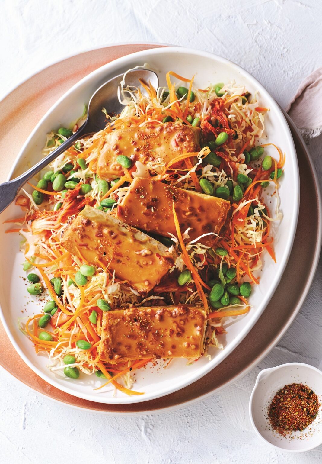 Baked tofu with satay sauce, edamame and kimchi slaw