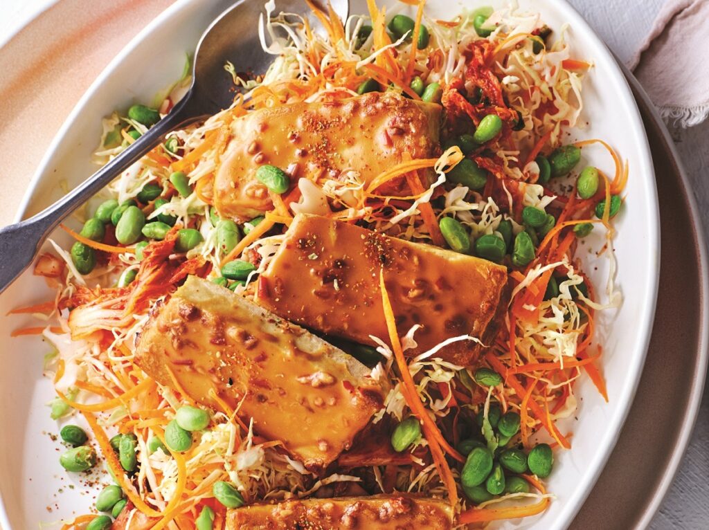 Baked tofu with satay sauce, edamame and kimchi slaw Baked tofu with satay sauce, edamame and kimchi slaw - web