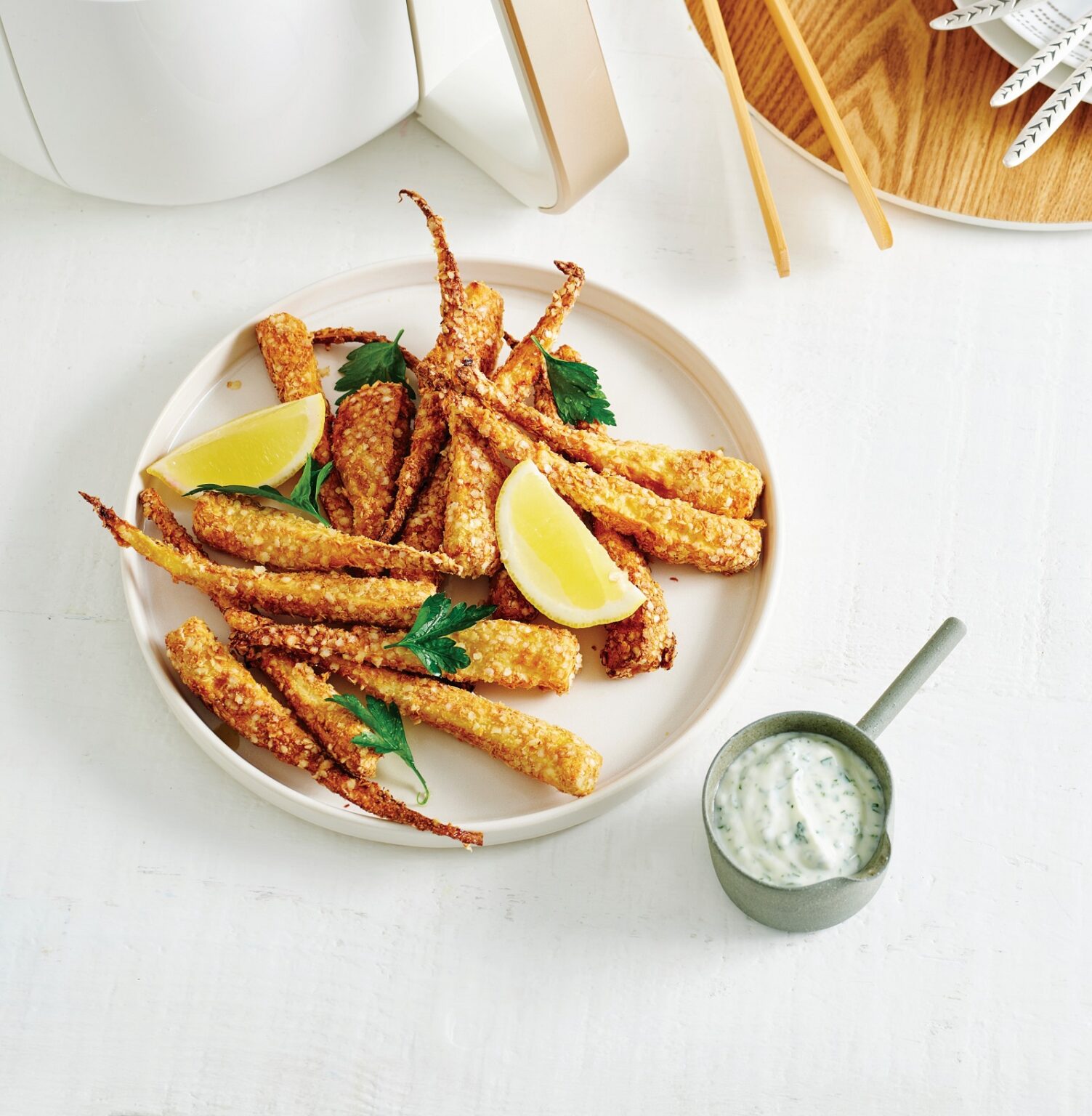 Crispy parsnip chips with lemon yoghurt parsley sauce