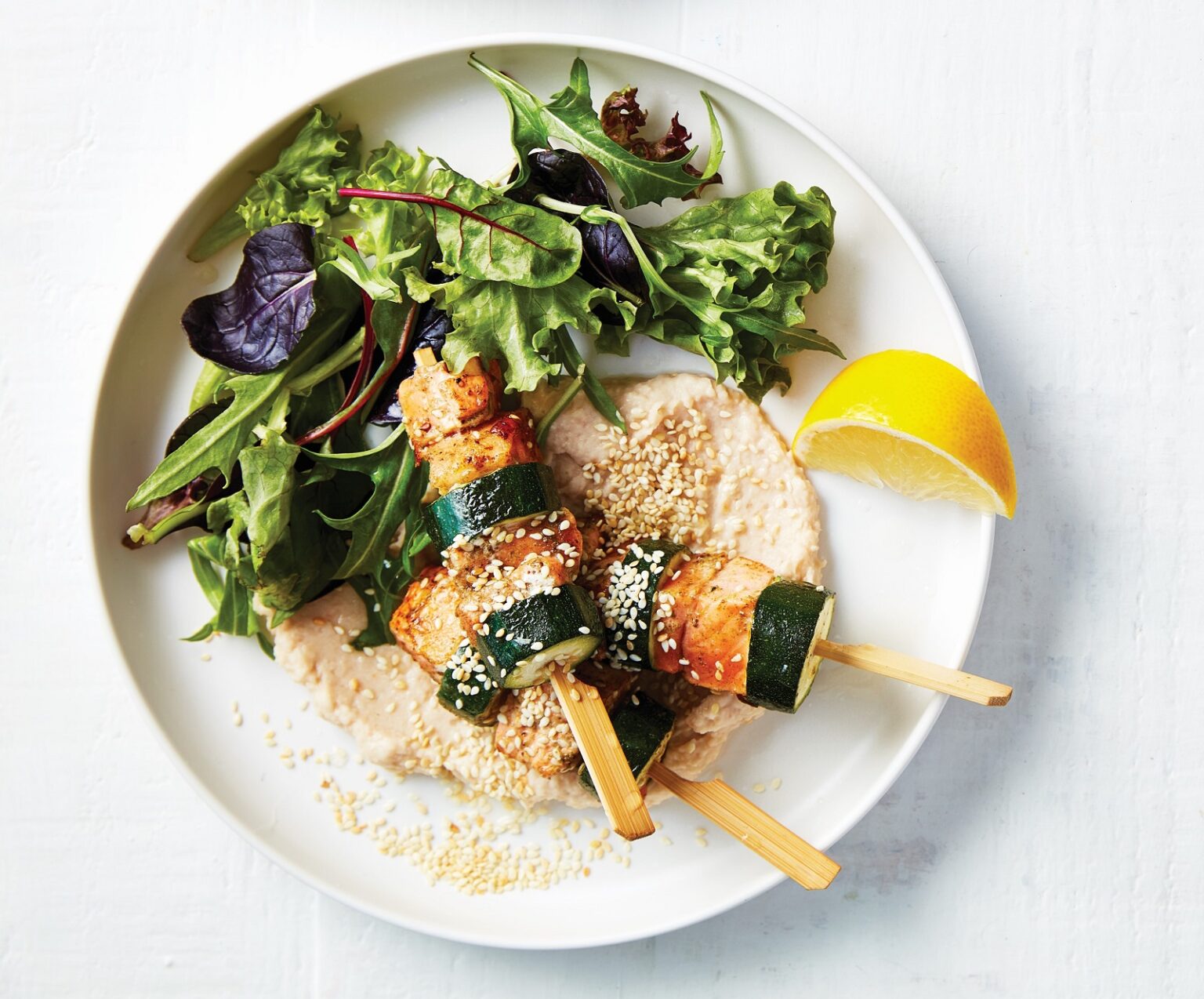 Salmon and zucchini skewers with white bean purée 
