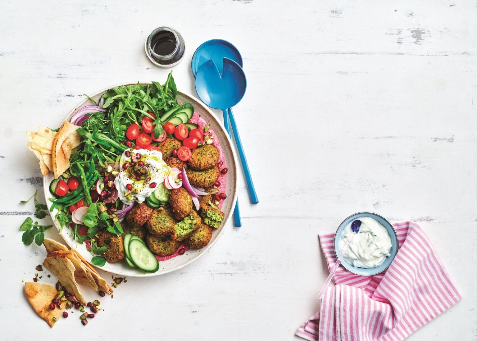 Falafel salad with beetroot hummus and tzatziki