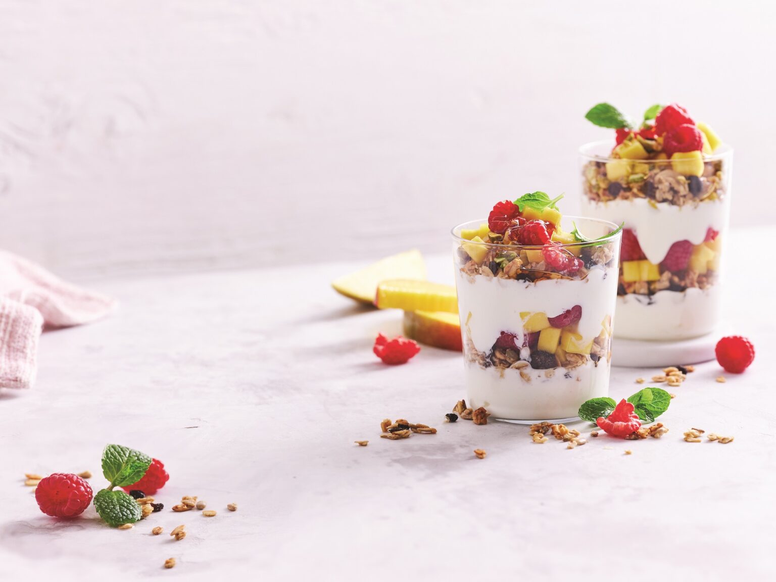 Raspberry and mango breakfast parfaits