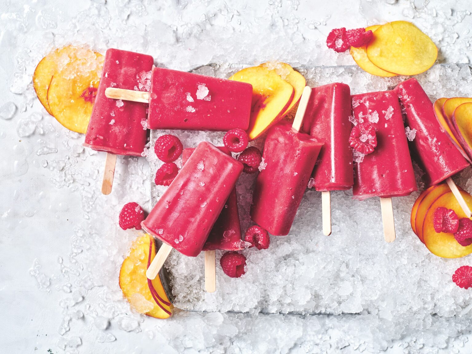 Peach and raspberry popsicles