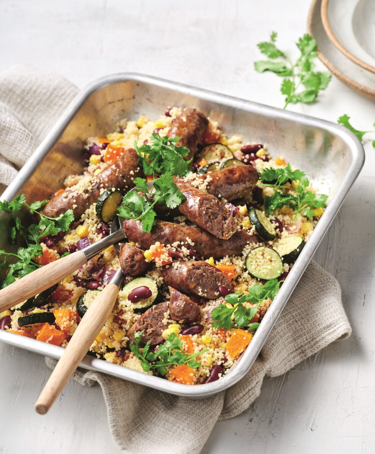 Vegie and couscous sausage traybake