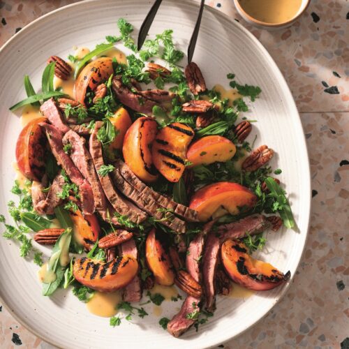 Flank steak salad with pecans and charred peaches
