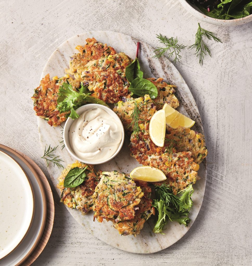 Zucchini and haloumi fritters with tahini sauce